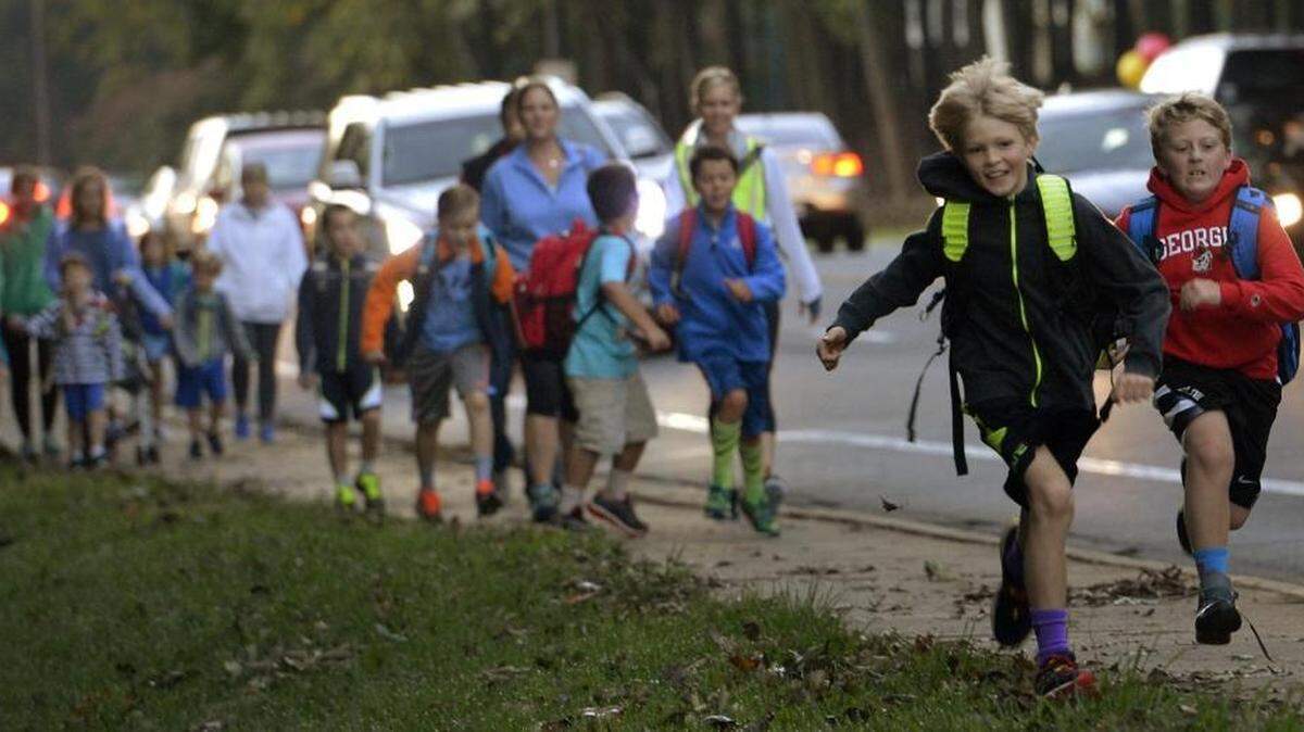 
Parents and kids head for Beverly Woods Elementary School for national Walk to School Day on Wednesday.
