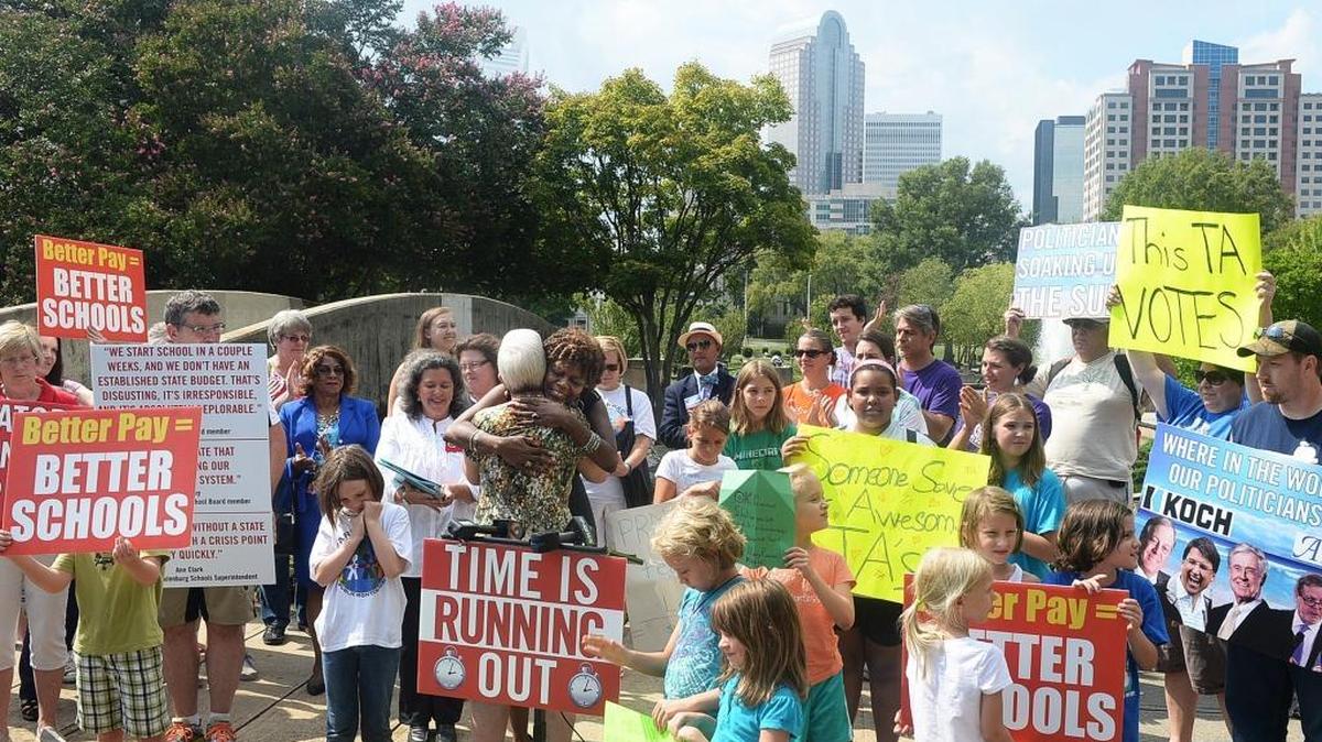 
Educators and citizens rallied in Charlotte this summer for better teacher pay and protection of teacher-assistant jobs.

