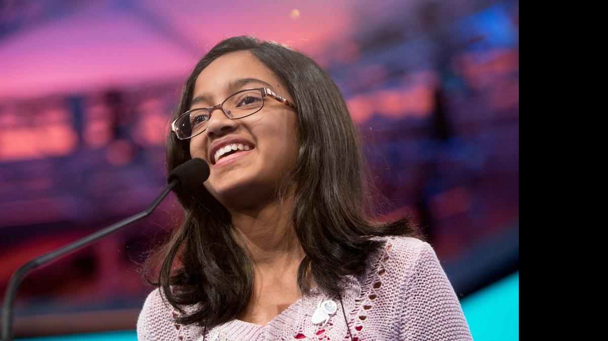
Akshra Paimagam, 12, a sixth-grader at Randolph Middle School in Charlotte, attempts to spell “calefy” in round five of the semifinals of the 2015 Scripps National Spelling Bee being held at the Gaylord National Resort and Conference Center in National Harbor, Md., on May 28, 2015. Akshra was eliminated after incorrectly spelling the word.
