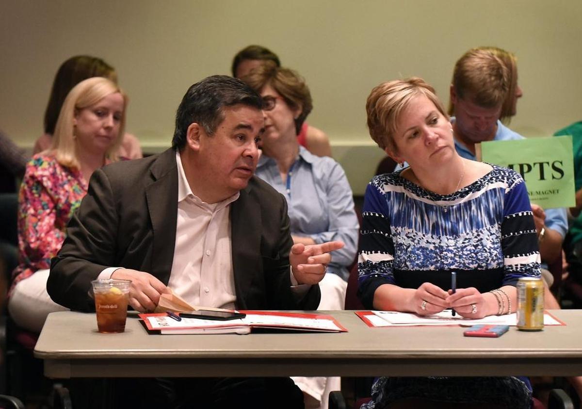 Superintendent Clayton Wilcox (left) and Chief of Staff Laura Francisco at a May school board meeting.