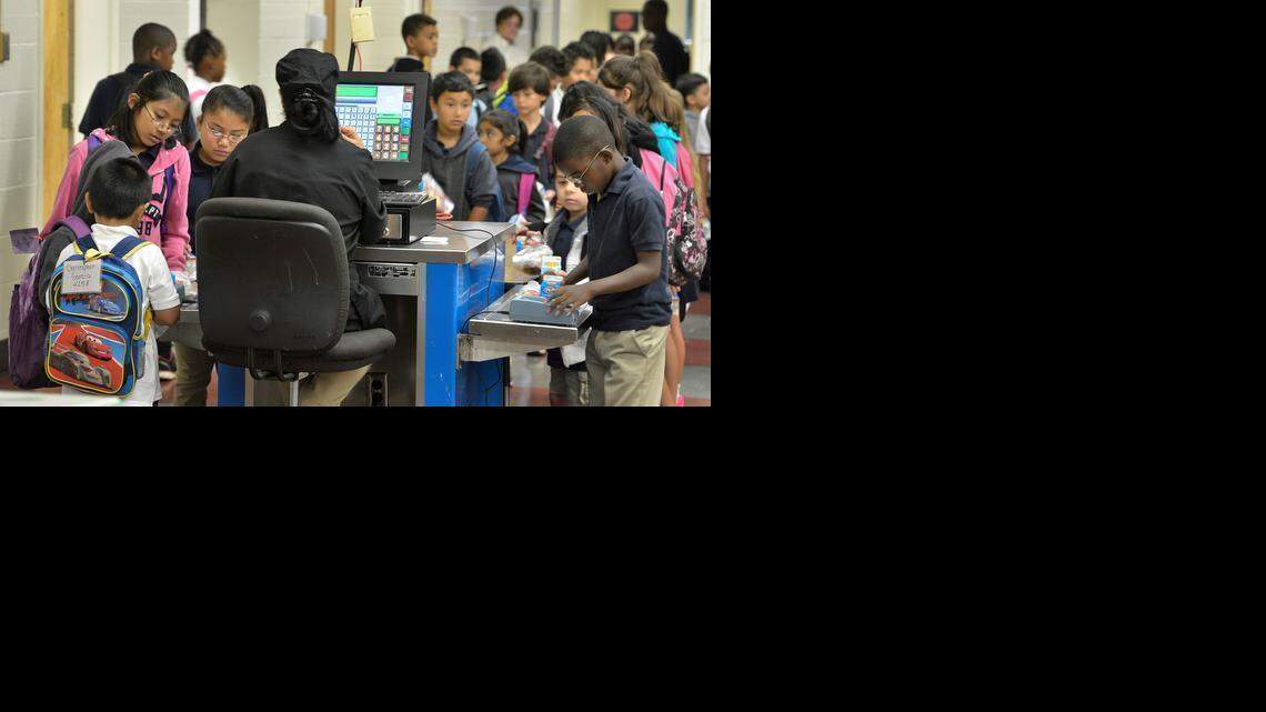 
Students at Montclaire Elementary School stand in the check-out line after selecting their breakfast early Tuesday morning, September 16, 2014. About 79 percent of the Montclaire Elementary’s students are Hispanic. Rapid increases in the Hispanic population kept CMS growing.
