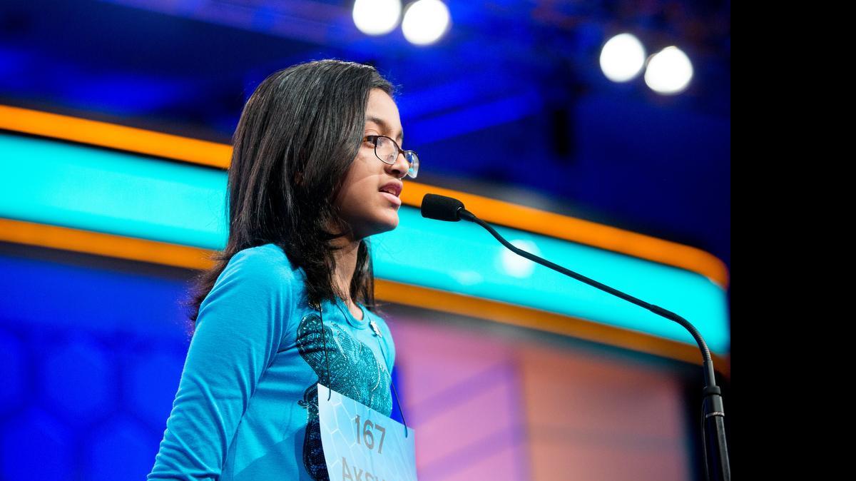 
Akshra Paimagam, 12, a sixth-grader at Randolph Middle School in Charlotte, correctly spells “nephelognosy” in round three – one of the preliminary rounds – of the 2015 Scripps National Spelling Bee being at the Gaylord National Resort and Conference Center in National Harbor, Maryland, on May 27, 2015.
