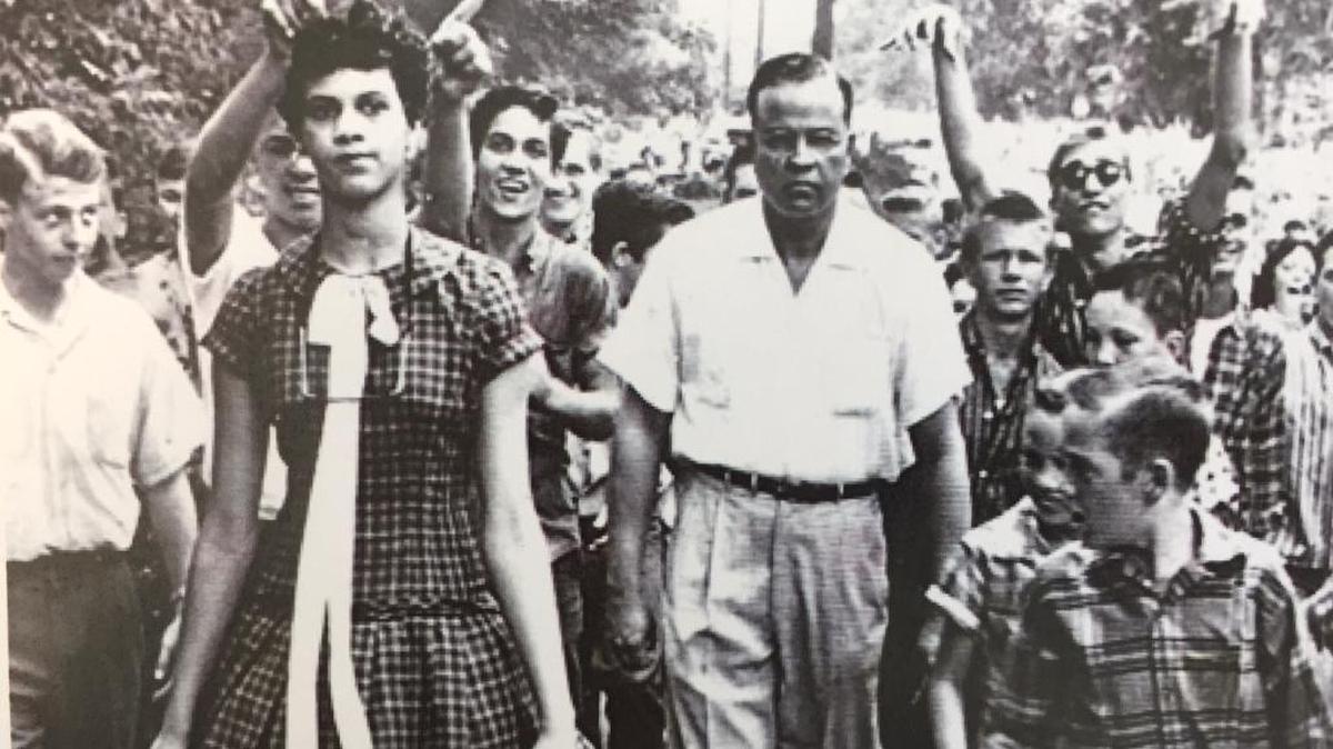 Dorothy Counts enters the all-white Harding High School surrounded by a jeering crowd in 1957.