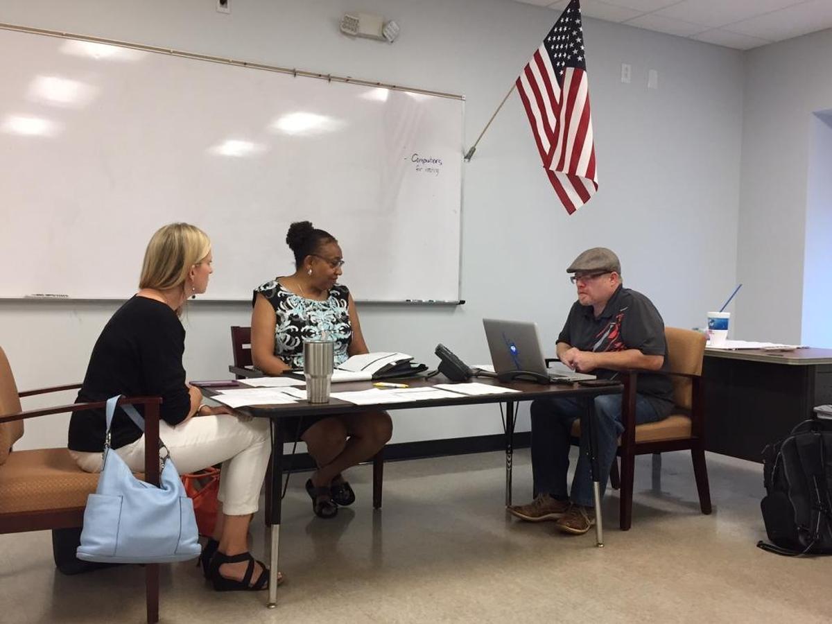 Thunderbird Prep board members Traci Fletcher, Janice Davidson and Vic Sassano (left-right) met July 27 in Cornelius with the two Utah-based board members on the phone.