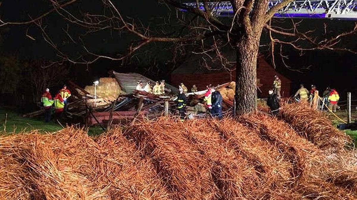 Firefighters at scene of the barn collapse