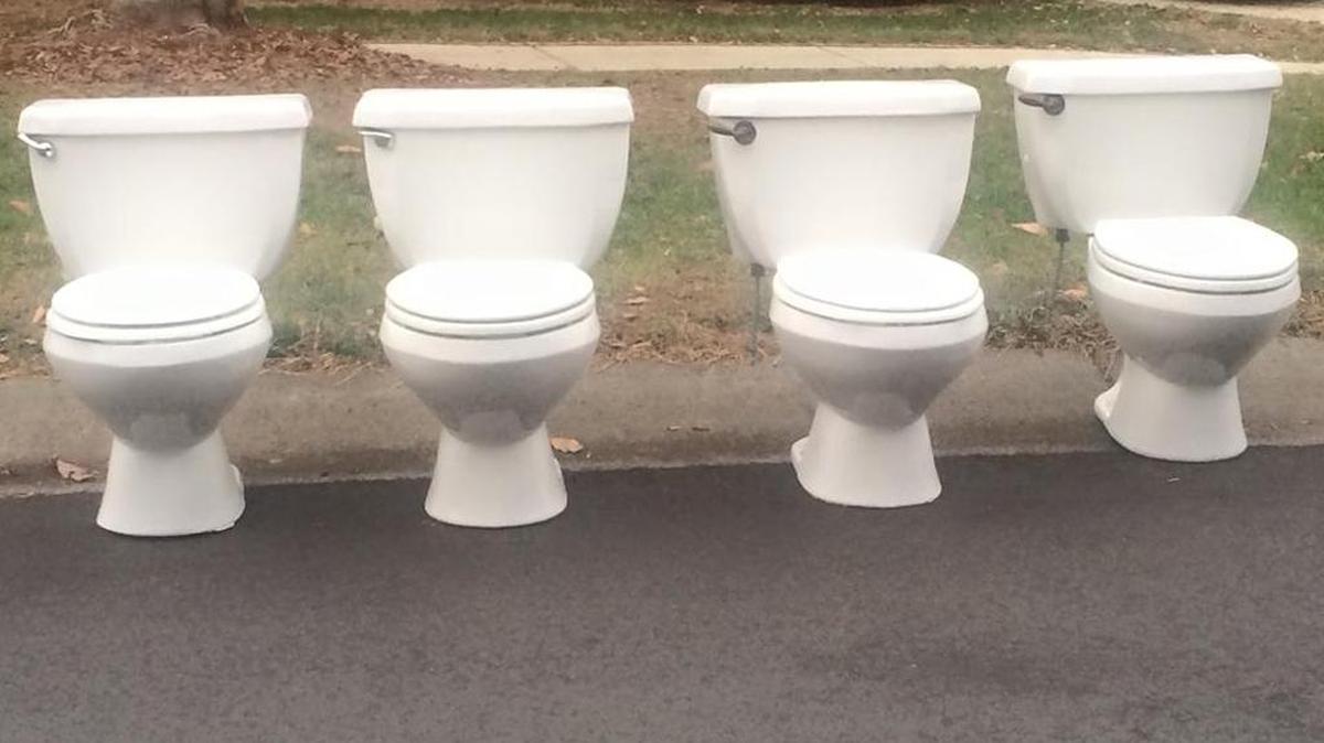 Four toilets lined up at the curb on Kilmonack Lane in southeast Charlotte.