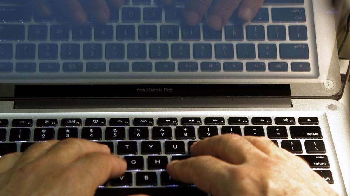 FILE - In this Feb. 27, 2013, file photo, hands type on a computer keyboard in Los Angeles. The N.C. Department of Health and Human Services announced Friday that a spreadsheet containing personal information was sent in error to a vendor in an unencrypted email. (AP Photo/Damian Dovarganes, File)