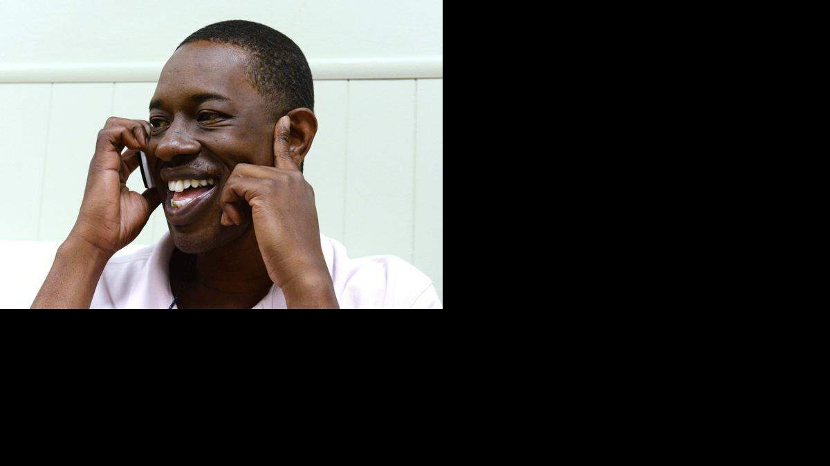
Kendrick Russell talks to his sister in Charleston, S.C., on a cellphone provided by Cricket Communications at the Charlotte Rescue Mission on Sunday.


