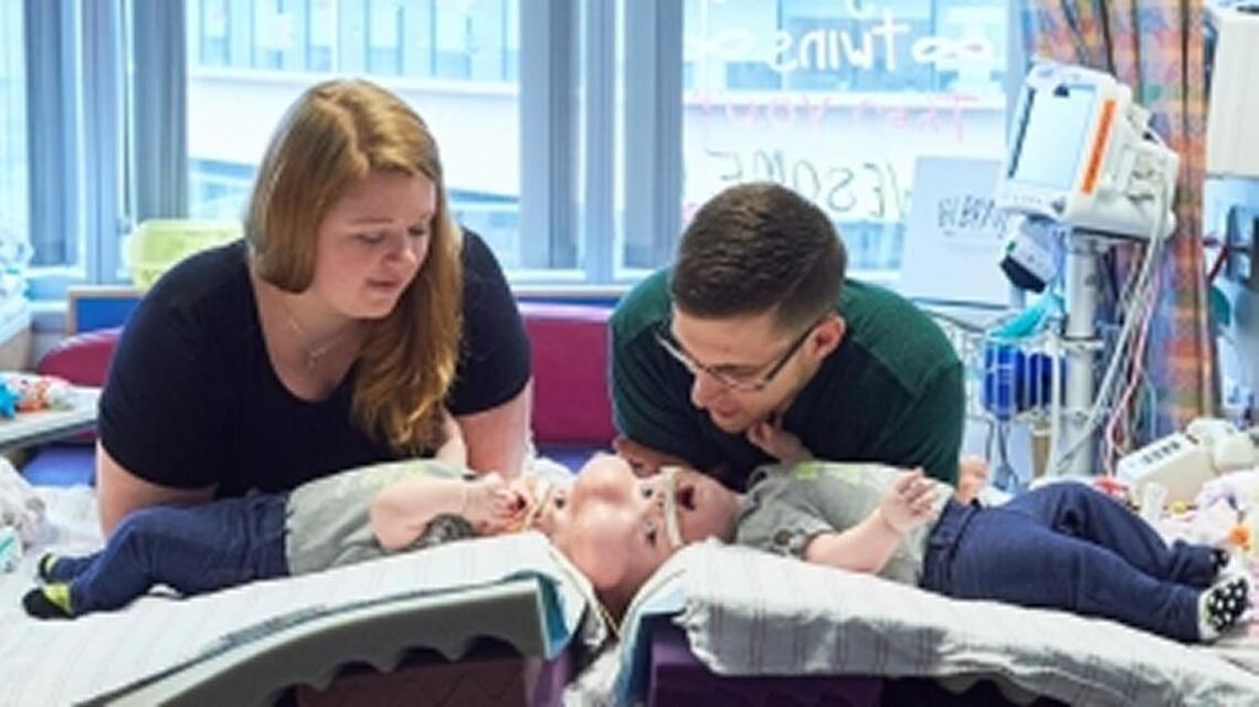 Born joined at the head, Mooresville twins now sleep side-by-side after surgery