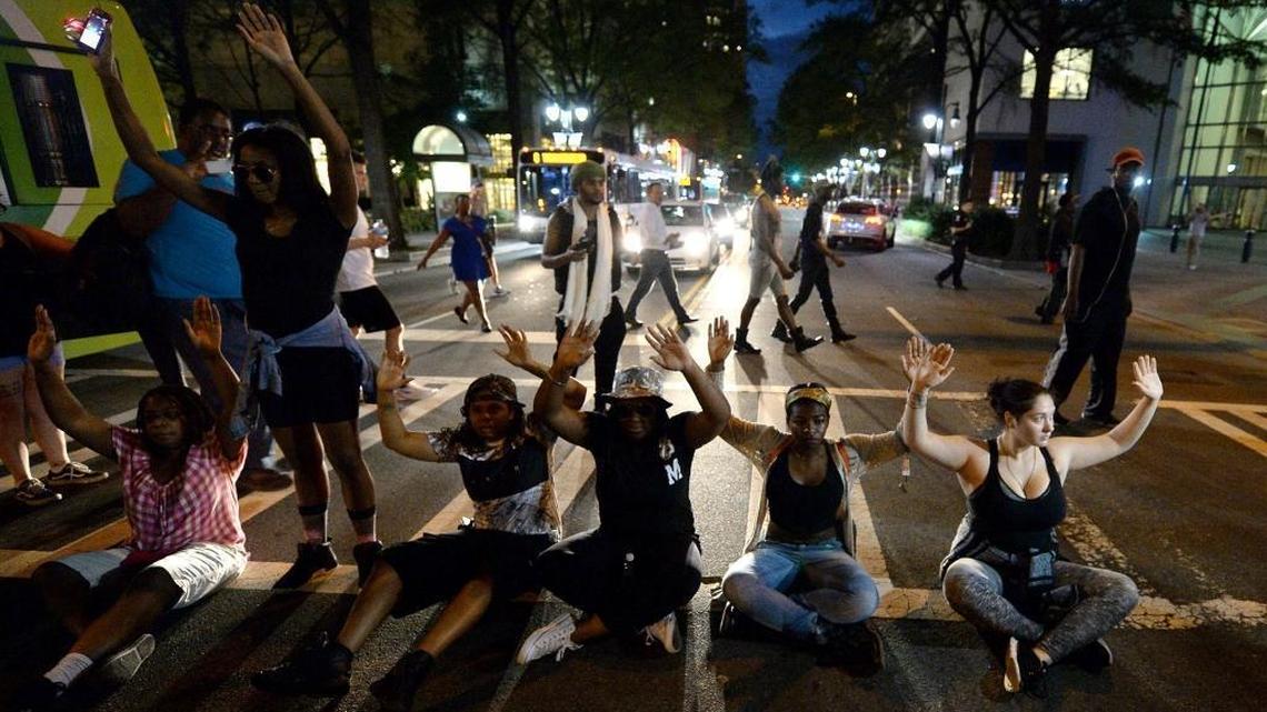 Protestors block an intersection at Trade and Tryon Streets in Charlotte on Wednesday.