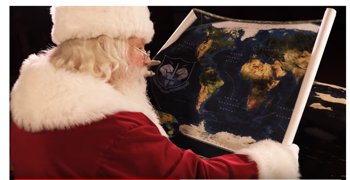 Santa consults his flight plan on Christmas Eve.