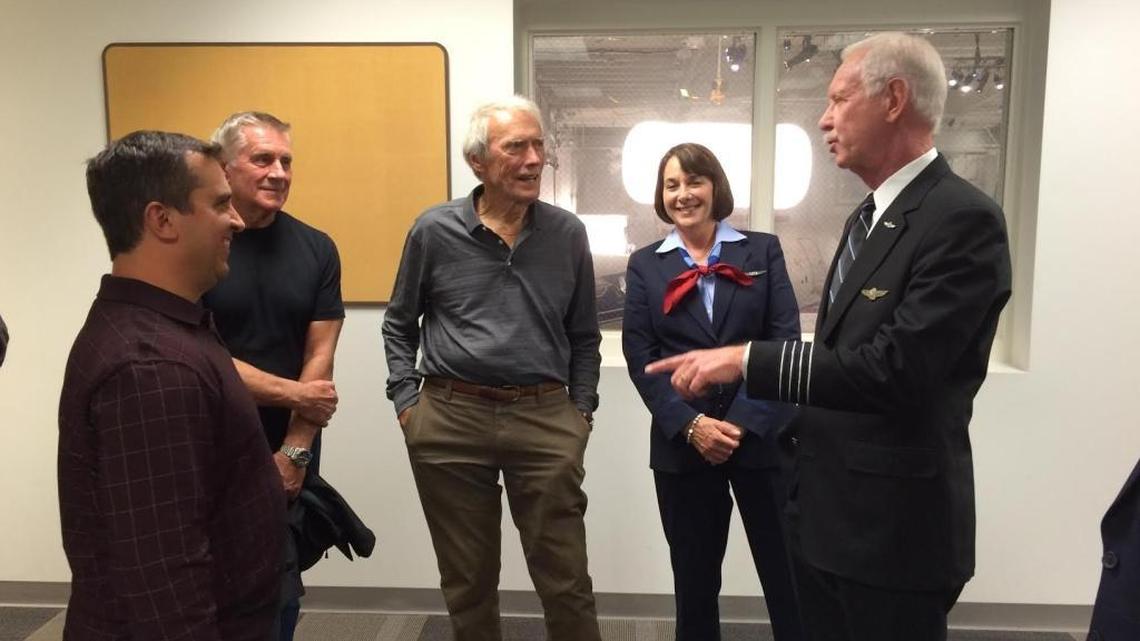 
Listening to Capt. Sully Sullenberger, at far right, are air traffic controller Patrick Harten, a production aide, film director Clint Eastwood and Flight 1549 flight attendant Sheila Dail.
