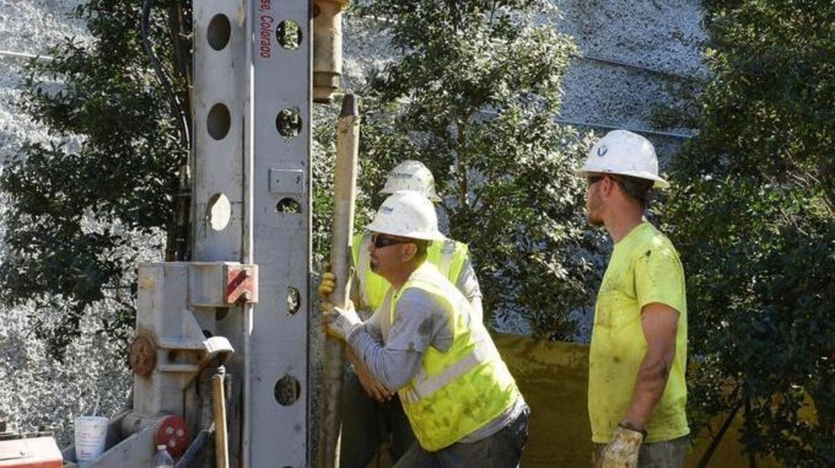 Foundation research began Tuesday on the planned Carolina Theatre renovation. Workers with AXIOM Foundation of Charlotte operate a drilling machine at the park in front of Carolina Theatre on March 22, 2016. The park has been blocked off and drilling of soil samples is being done to find out where foundations will be created to build a new building on top of the park. Work will start this summer.
