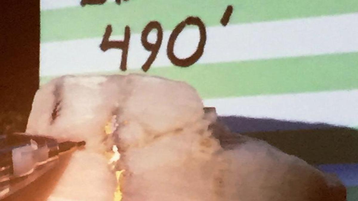 Gold drips from a rocky chunk of earth dug from a new mining site north of Camden.