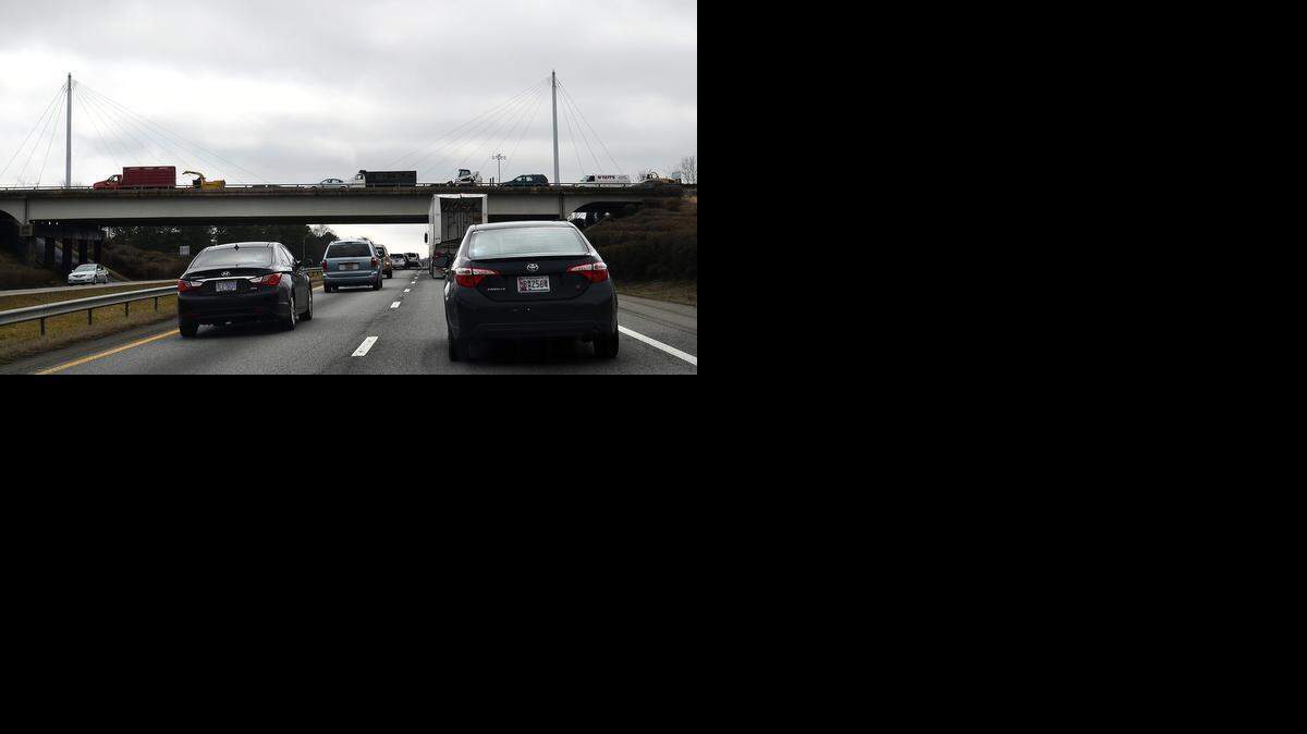 

Traffic approaches the Exit 28 bridge on an overcast day. Residents have complained that the cables and masts are hard to see. 
