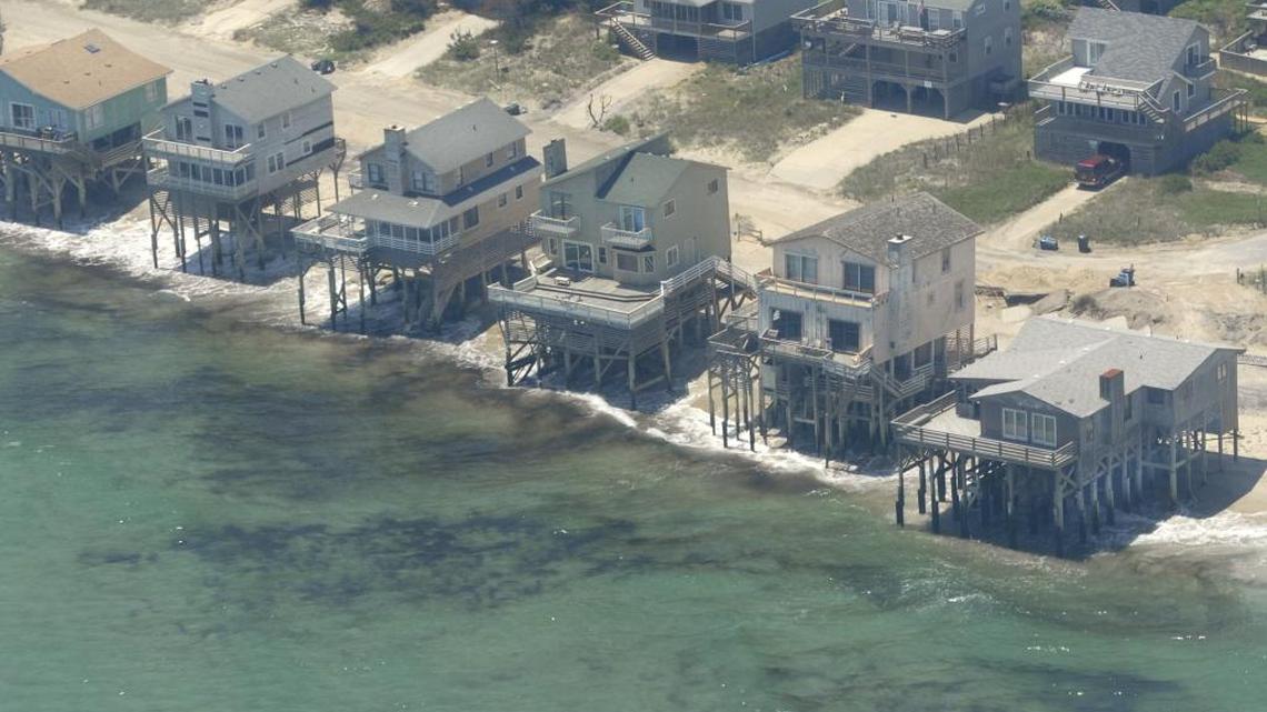Rising sea levels, which scientists attribute to climate change, threaten homes along North Carolina’s Outer Banks, such as these in Nags Head in 2010.
