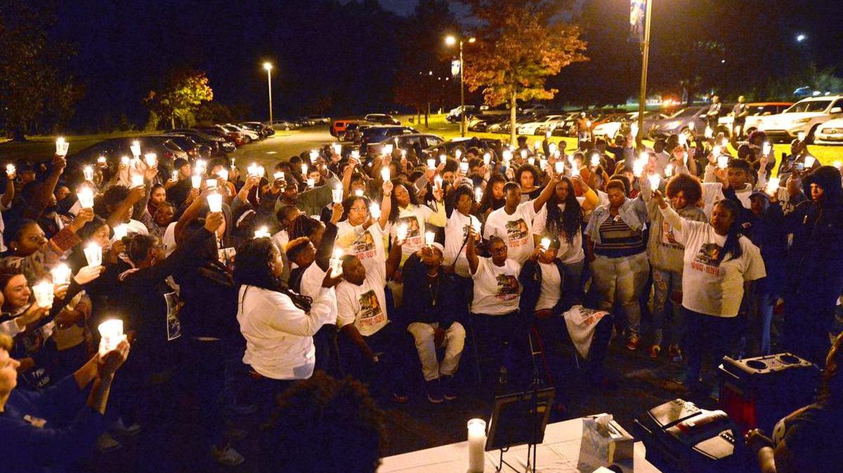 Family and friends gather in remembrance of Bobby McKeithen, a Butler High School sophomore who was shot and killed Monday in a hallway at the school.