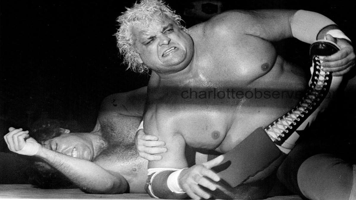 
Dusty Rhodes applies the pressure of a hold to Tully Blanchard. April, 1985
