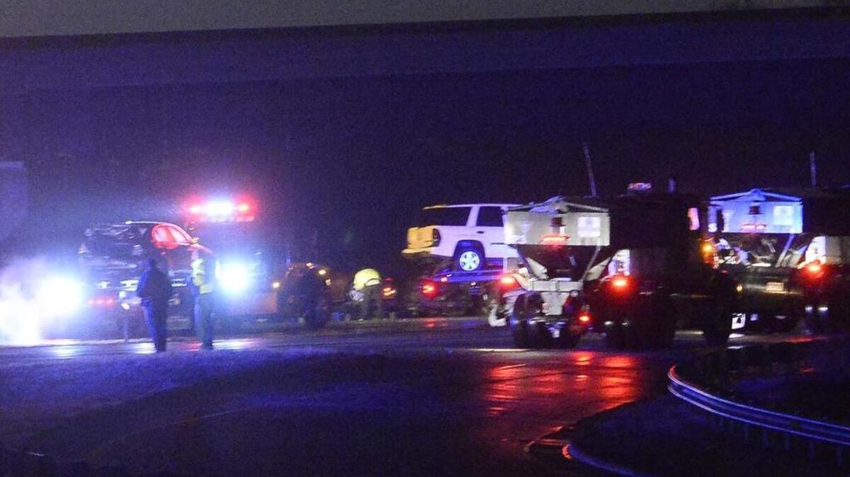 Tow trucks remove cars from Interstate 485 after a wreck on Monday, Feb. 15.