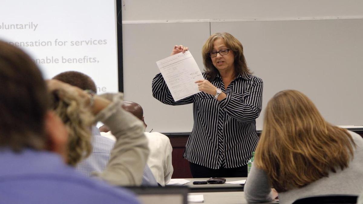 
Labor relations officer from HUD Dondra Merrell leads a training seminar for local government officials on how to verify workers are paid properly on federally funded housing projects at the Herb Young Center in Cary in this May 14, 2014, file photo.

