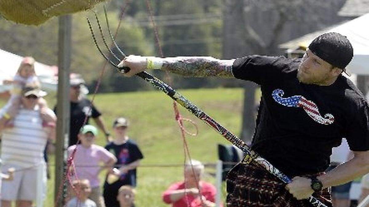 
Brett Nenaber of Charlotte propels the 20-lbs. bag as he competes in the Sheaf Toss event during last year’s Loch Norman Highland Games. 
