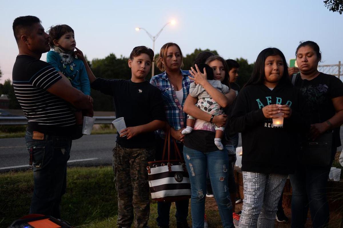 Friends and family grieve during a vigil Friday night to remember Ruben Galindo.