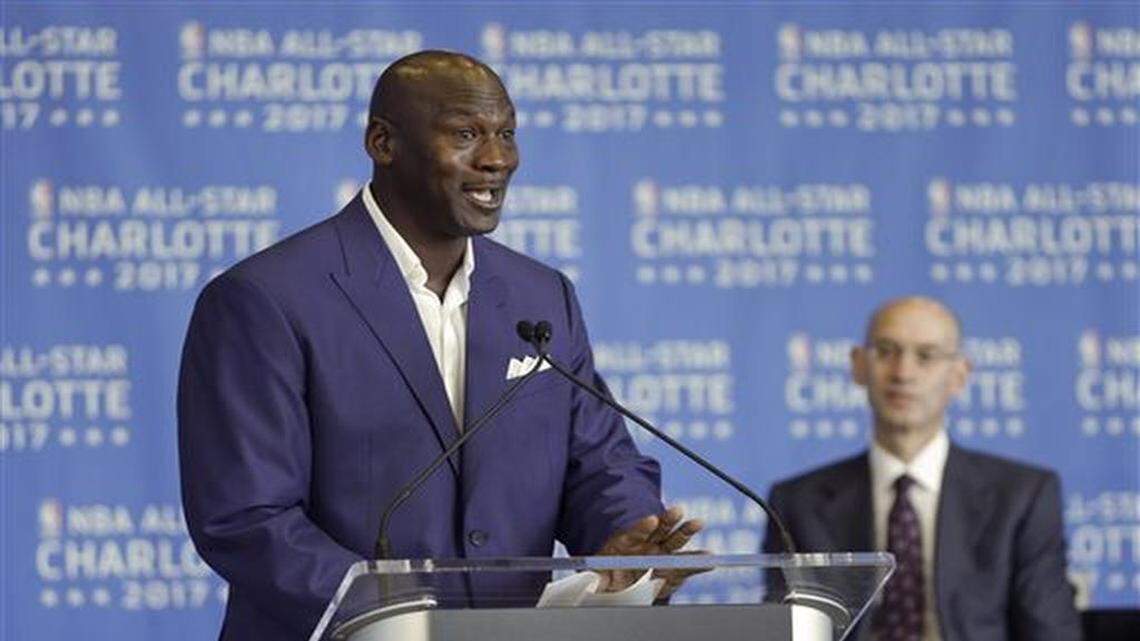Charlotte Hornets owner Michael Jordan, left, speaks as NBA Commissioner Adam Silver, right, listens during a news conference, Tuesday, June 23, 2015, to announce Charlotte, N.C., as the site of the 2017 NBA All-Star basketball game.
