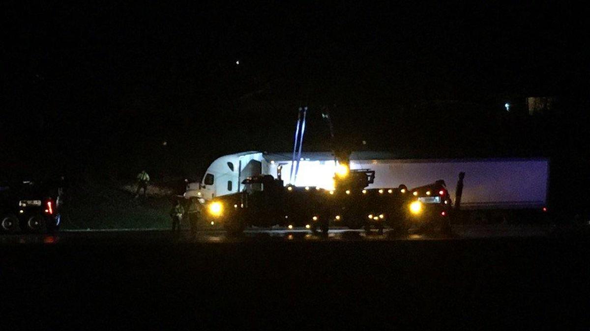 A tractor-trailer was towed from Interstate 85 northbound near the Sam Wilson Road exit after it crashed into a car parked along the shoulder early Wednesday.