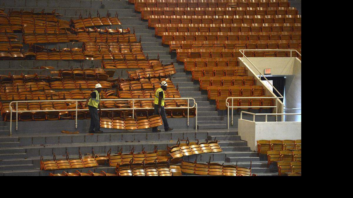 
Workers remove seats, lights and other items from the interior of Bojangles' Coliseum on Tuesday June 30, 2015. Workers started Monday on the $16 million renovation to make improvements to seating, technology, locker rooms, building infrastructure and more to prepare for the Charlotte Checkers return in the 2015-16 season.
