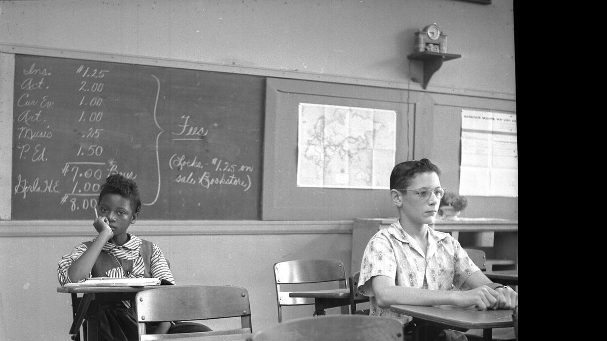 
Delois Huntley sat in the back her homeroom class, taught by Emory Mason. "I sat near the back of the class - no one prompted me back there, that was just of my own choosing. It didn't bother me that I sat there alone." CHARLOTTE OBSERVER ARCHIVE - ROBINSON/SPANGLER CAROLINA ROOM, PUBLIC LIBRARY OF CHARLOTTE & MECKLENBURG COUNTY 
