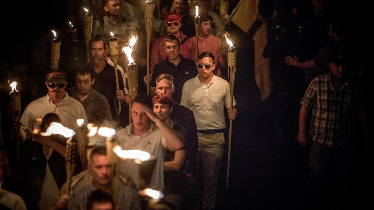Chanting “White lives matter!” and “Jews will not replace us!” several hundred protesters carrying torches marched in a parade through the University of Virginia campus in August. An anti-communist group that says it aims to defend communities against ‘leftist terrorists and rioters’ plans to hold a torch march and rally in Charlotte.