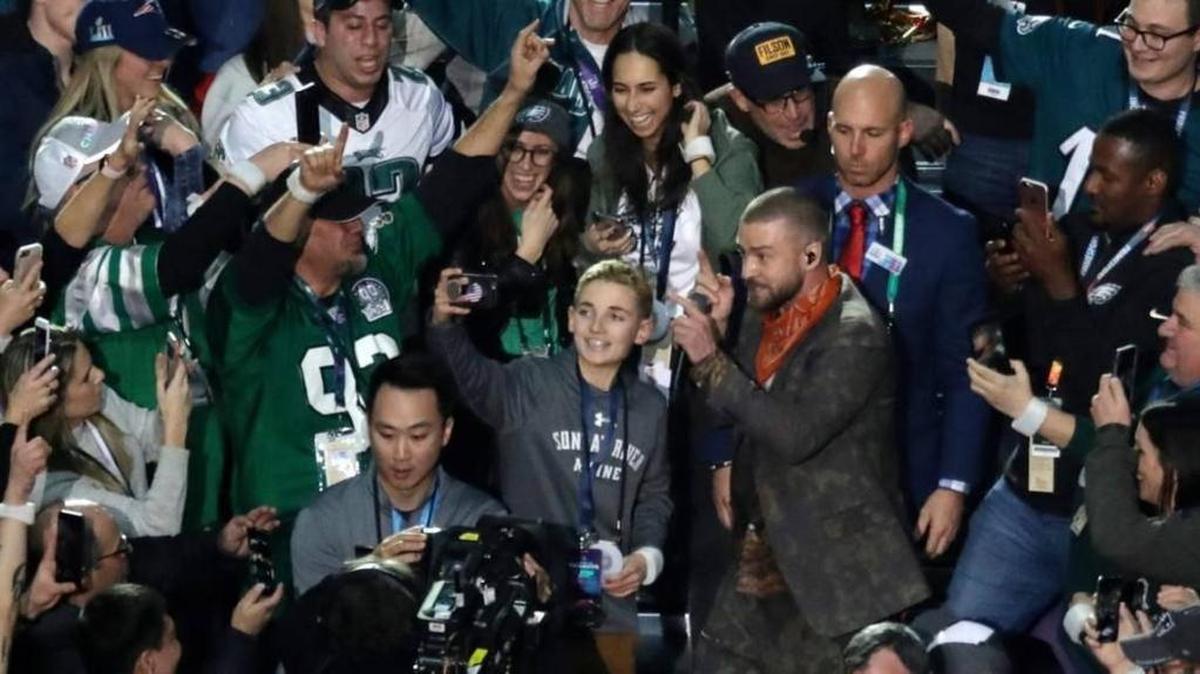 Thirteen-year-old Ryan McKenna takes a selfie as Justin Timberlake Super Bowl 52 halftime