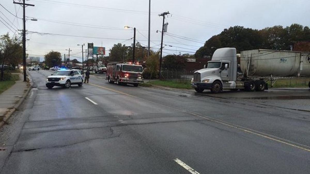 Part of North Tryon Street is blocked between 30th and 32nd streets after a tractor-trailer struck a utility pole.