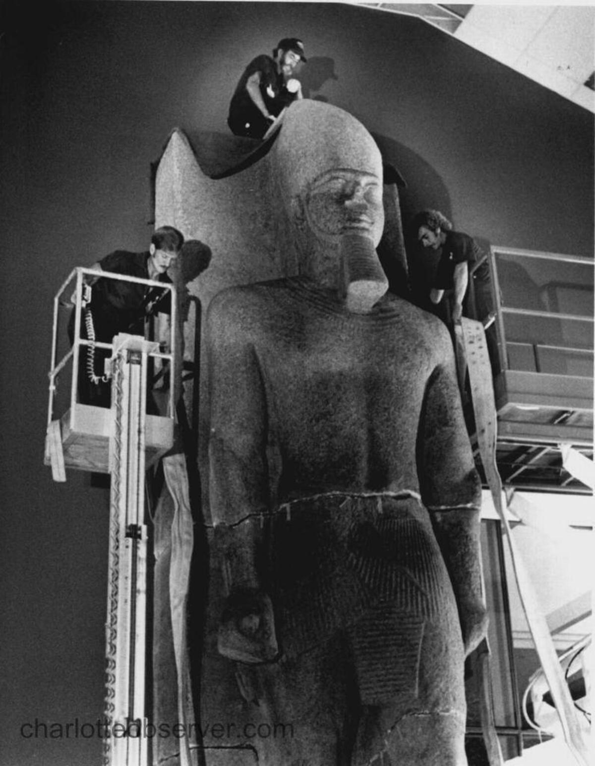 Workmen install the Ramesses statute in September, 1988. Jeep Hunter The Charlotte Observer