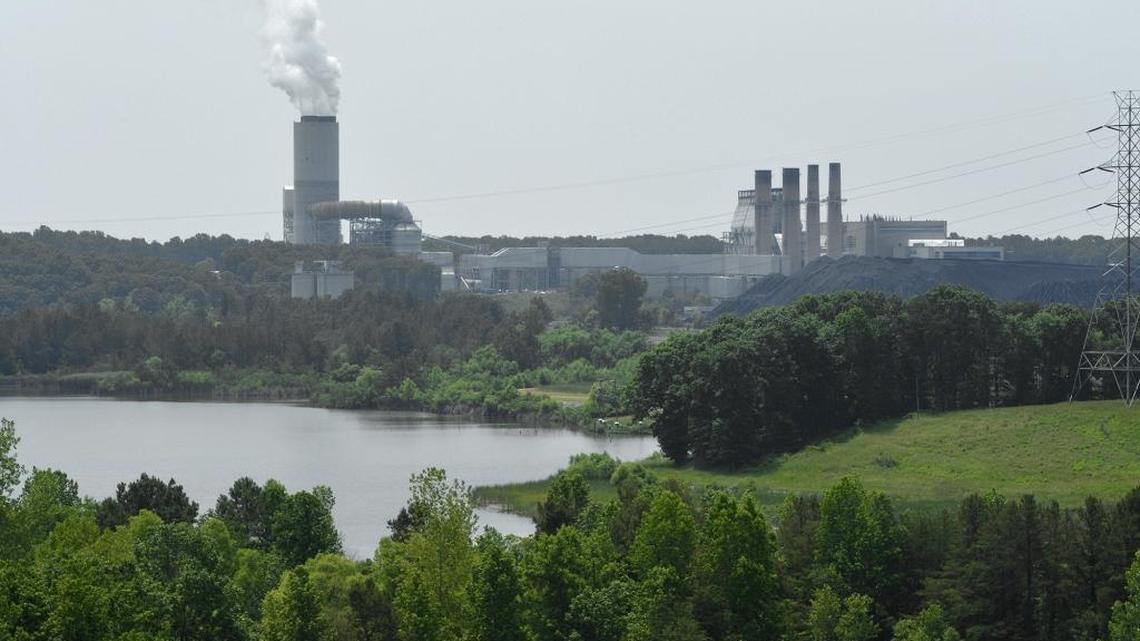 A mountain of coal stands next to Duke Energy's Marshall Steam Station on Lake Norman.
