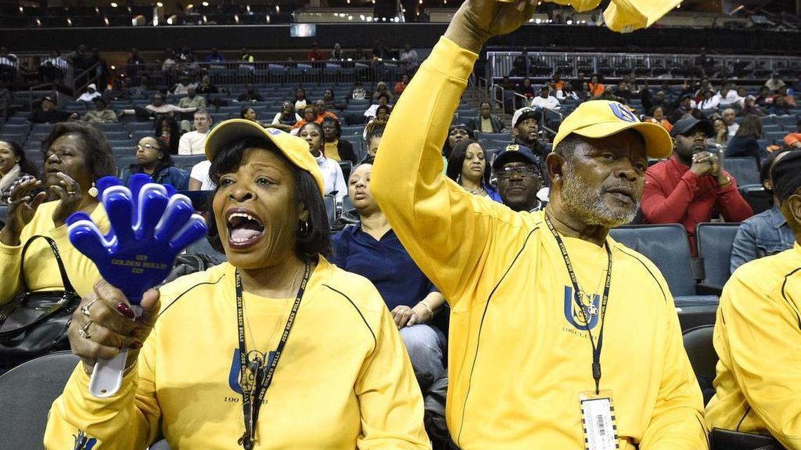 Johnson C. Smith University Booster 100 members Hattie Dewalt and her husband Tom Dewalt both of Charlotte, cheer on the JCSU “Golden Bulls” women’s basketball team while JCSU plays against Livingstone College “Lady Blue Bears” in the 2015 CIAA tournament women’s quarterfinals
