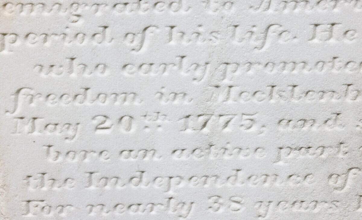 A tombstone details the life of a Revolutionary War soldier at the Steele Creek Presbyterian Church cemetery in Charlotte.