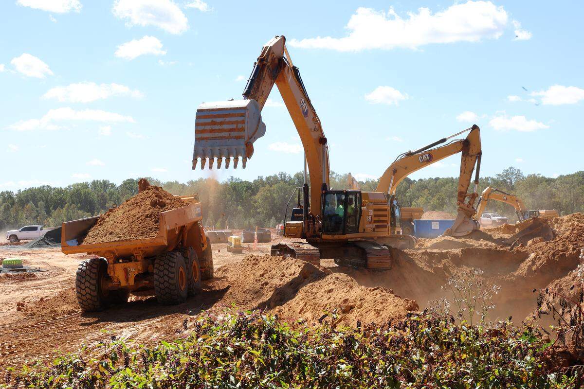 A crew works on a future neighborhood of 600 homes next to the Autumnwood neighborhood in Charlotte. Residents said they understand the need for the development but the dust, noise and damage to their properties has put a bad taste in their mouths. 