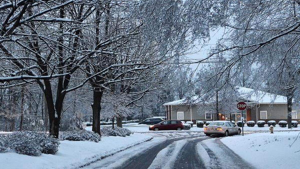 
Traffic moved well along Prosperity Church Road at White Cascade Drive as main roads were mostly slush. Trees in the University area were weighed down by a wet and heavy snow on their branches on Thursday, Feb. 26, 2015.
