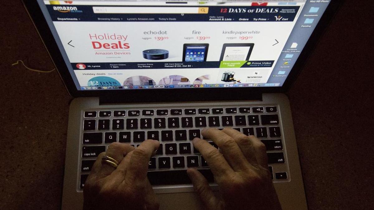 FILE – The National Retail Federation estimates more than 81 million people made online purchases on “Cyber Monday” in the United States in 2017. Technology security experts warn scammers may target shoppers via phony emails and malicious software.