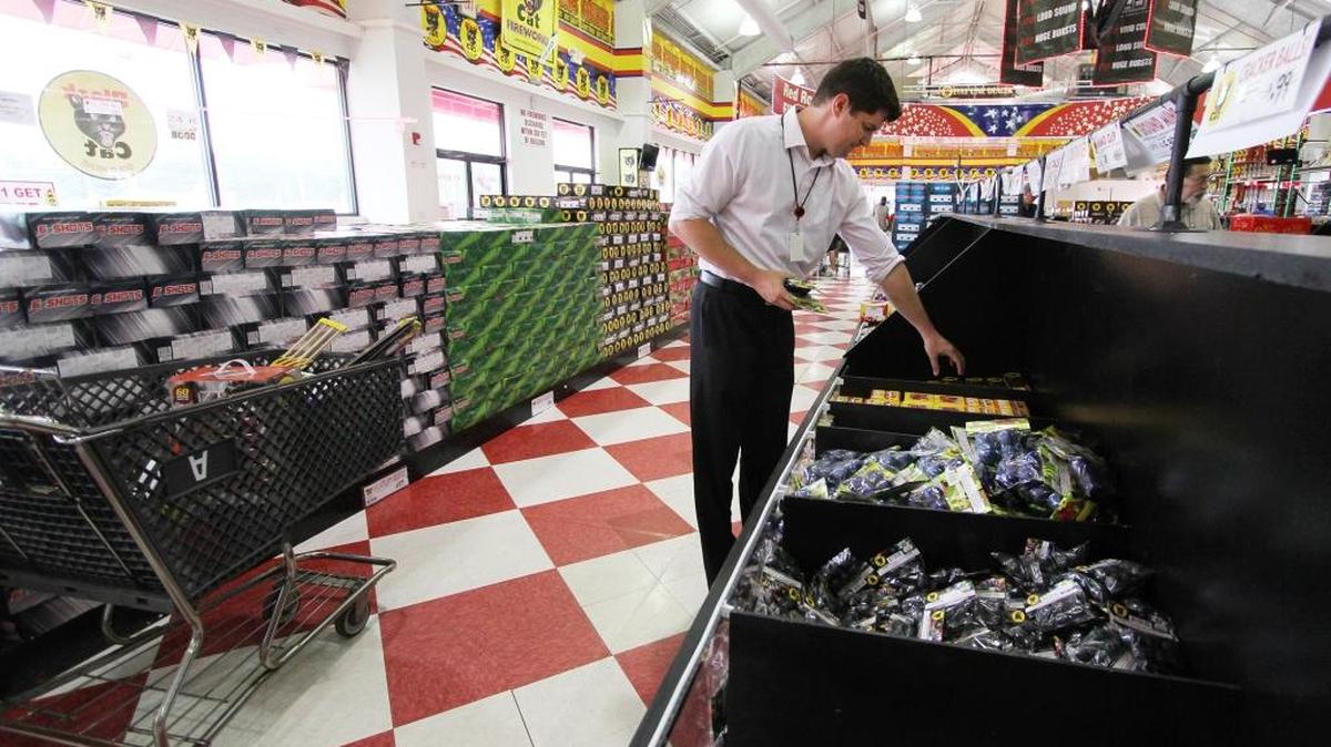 Matt Pilz of Huntersville looks through a display of fireworks Thursday at Red Rocket Fireworks in Fort Mill Township.