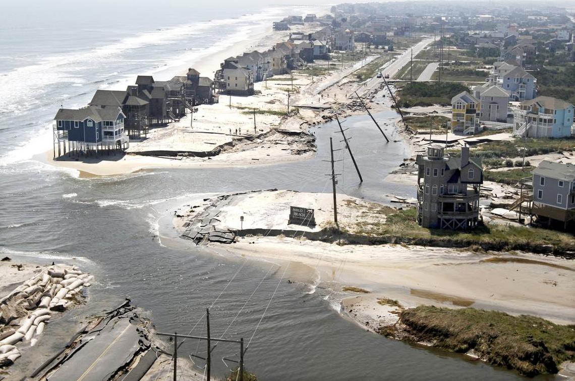 This aerial view looks south of N.C. 12 where the Atlantic Ocean breached the road on Hatteras Island north of Rodanthe, after Hurricane Irene swept through in August 2011.