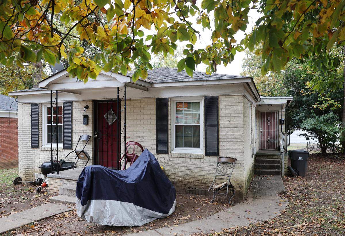 Charlotte police officers shot Sanrico McGill outside his residence, shown here, in December 2023. McGill then went into his residence, through the door at right, and died.