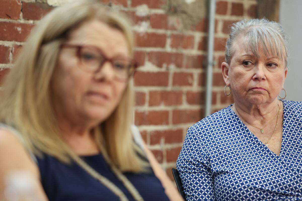 Sylvia Baird, right, looks at Denise Weiss as they both recall incidents following US Airways flight 1401 from St. Thomas, U.S. Virgin Islands to Charlotte. They were treated at Presbyterian Hospital after they reported feeling ill during that flight.