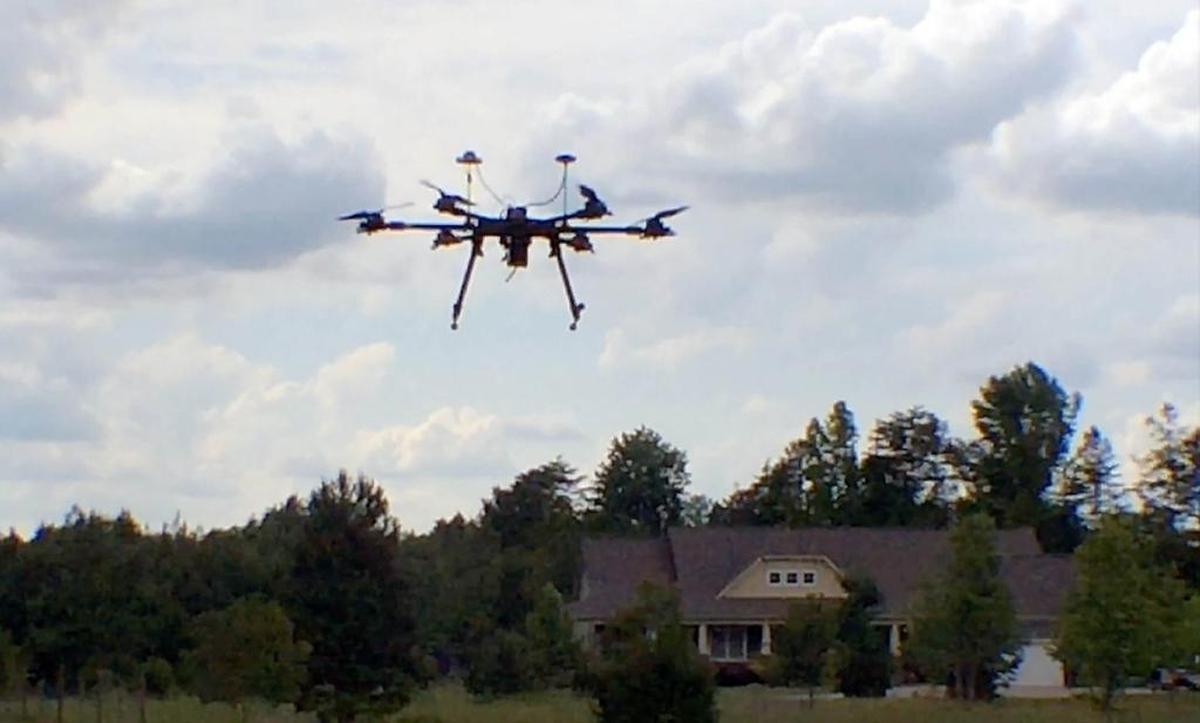 Greg Baker’s custom-built drone hovers near his Charlotte home. He and his Charlotte Drone Meetup Group advocate responsible flying of drones including flying away from people and buildings.