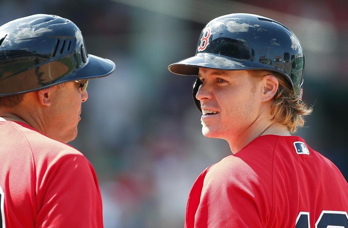 Boston Red Sox player Brock Holt, right, talks with first base coach Ruben Amaro Jr after hitting a single during the seventh inning of the first game of a baseball doubleheader against the New York Yankees in Boston on Sunday.