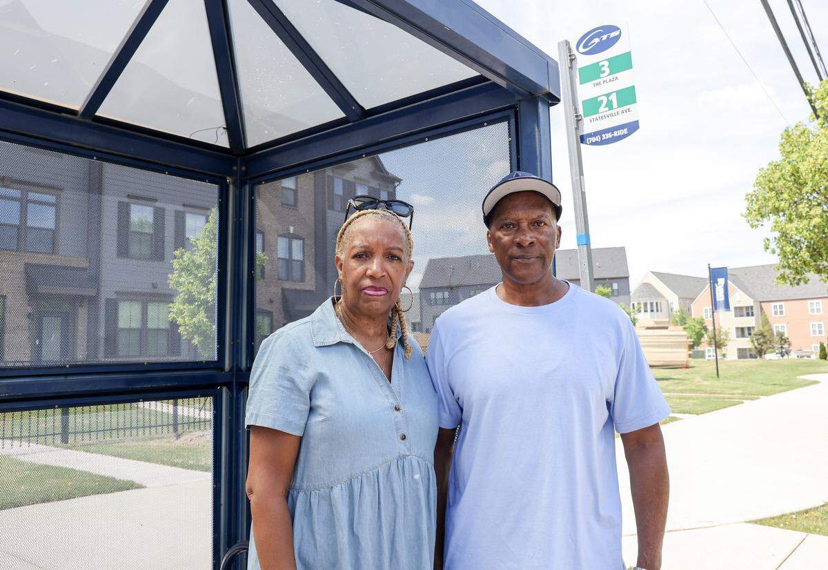 Former bus drivers Sheila Andrews, left, and David Harris, shown at a bus stop, worked as bus drivers for the Charlotte Area Transit System.