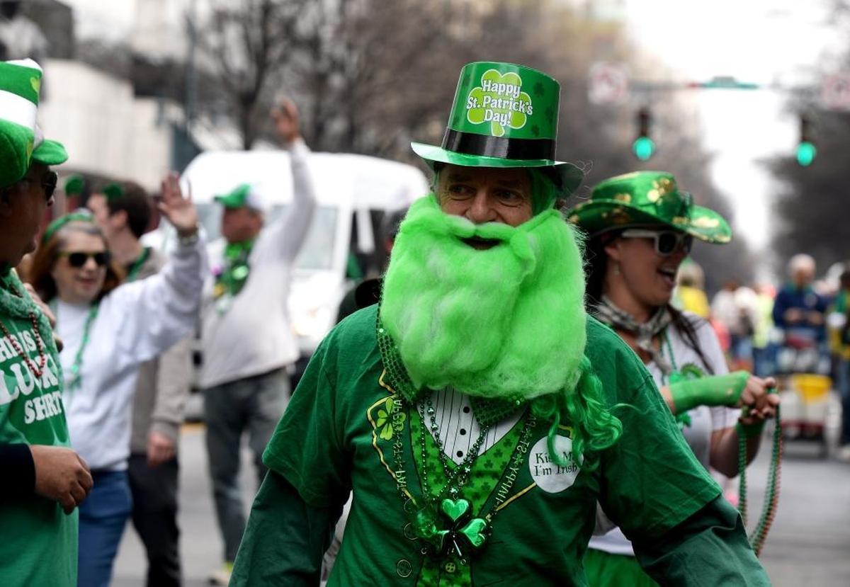A green-bearded gent joins in a past Charlotte St. Patrick’s Day Parade. The 2023 version is set for Saturday, March 11. 