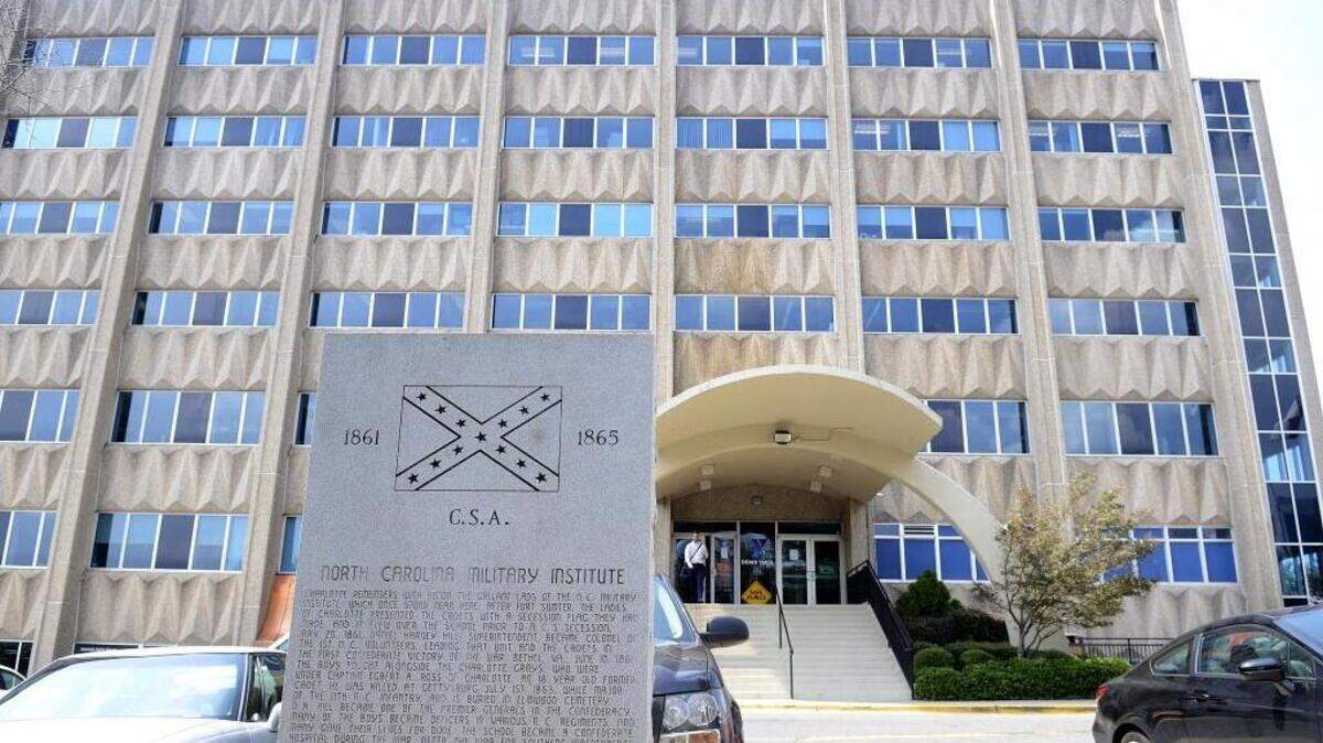 
A stone monument at the Dowd YMCA sits on the East Morehead Street side of the property near the sidewalk. The monument celebrates cadets who attended the North Carolina Military Institute in the late 1850s and early 1860s. During renovations to the Dowd, the YMCA wants to remove the monument, which contains an image of the Confederate battle flag. 
