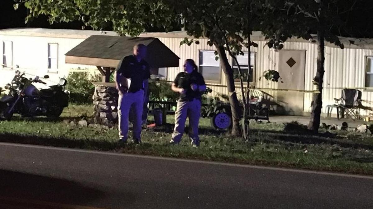 Investigators outside the site of a teen shooting in Denver, N.C.